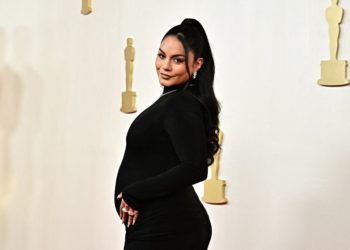 Vanessa Hudgens debuts baby bump on Oscars 2024 red carpet